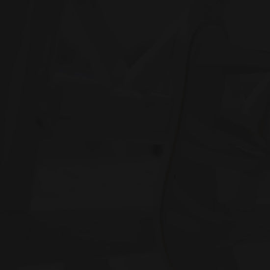 Andromeda Greek Leather Sandal – White braided version – single sandal hanging/displayed, showing braided front strap and white leather details