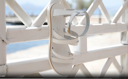 Andromeda Greek Leather Sandal – White braided version – single sandal hanging/displayed, showing braided front strap and white leather details